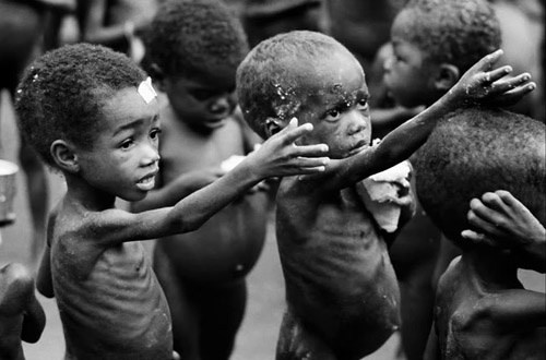 Hunger throughout the land. Children reaching for food.